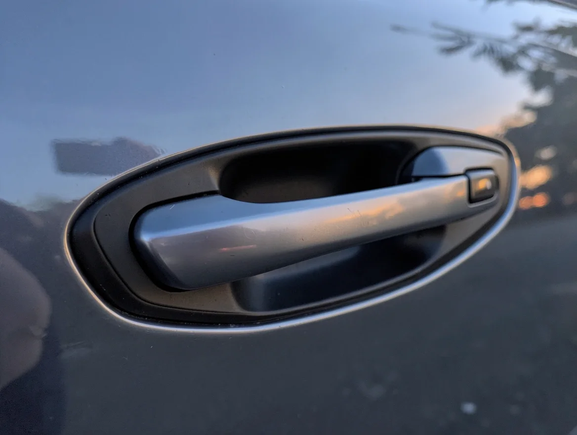 Car exterior door handle with a keyless entry touch sensor