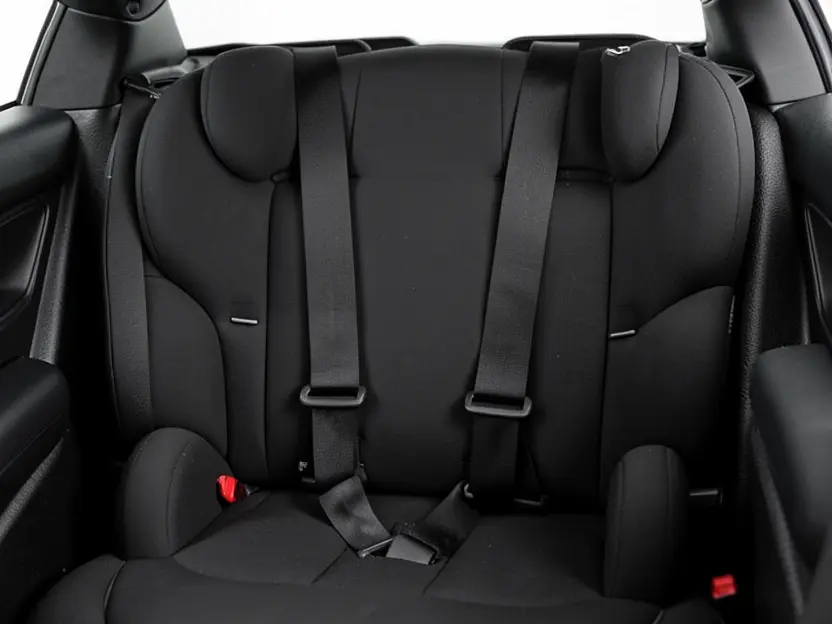 Empty convertible car seat showing harness shoulder strap slot positions