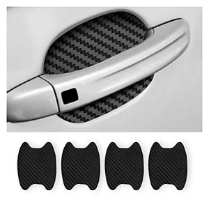 Carbon fiber car door cup protector installed on a silver car door handle to prevent scratches