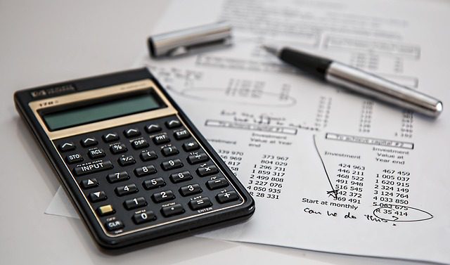Calculator and paperwork representing insurance costs and co-payments