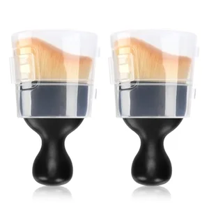 Two black-handled curved car interior detailing brushes with soft bristles and protective covers