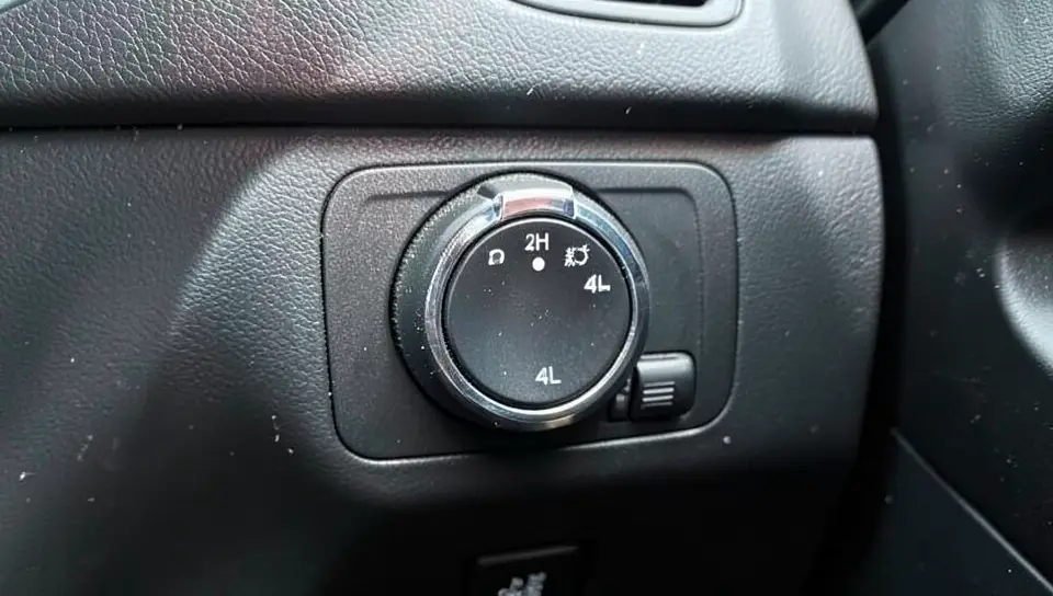 A pickup truck 4WD transfer case selector dial showing 2H, 4H, and 4L settings
