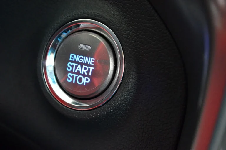 Mechanic installing an aftermarket keyless entry module inside a car door area