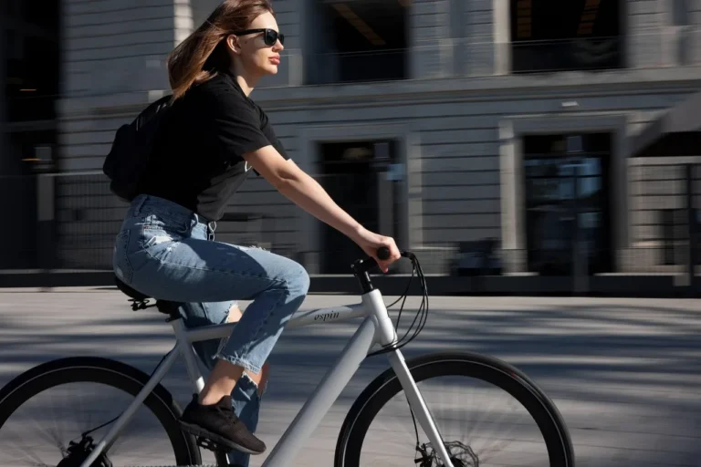 Alternative transportation to cars near a transit stop with a bicycle, bus, and rideshare pickup area.