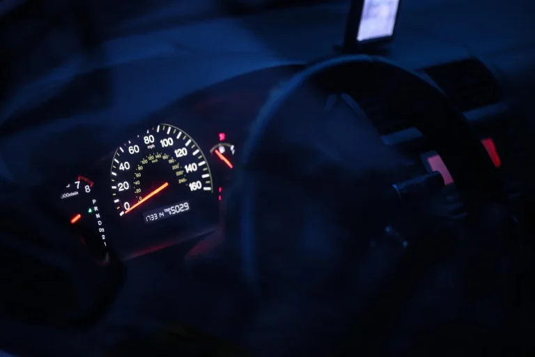 Honda CR-V dashboard and center display with a driver checking a status message.