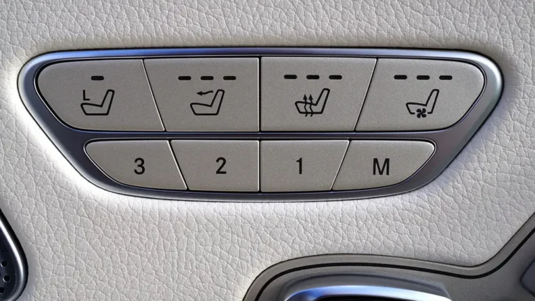 Driver reclining in a sedan with a heated car seat massager covering the full seat
