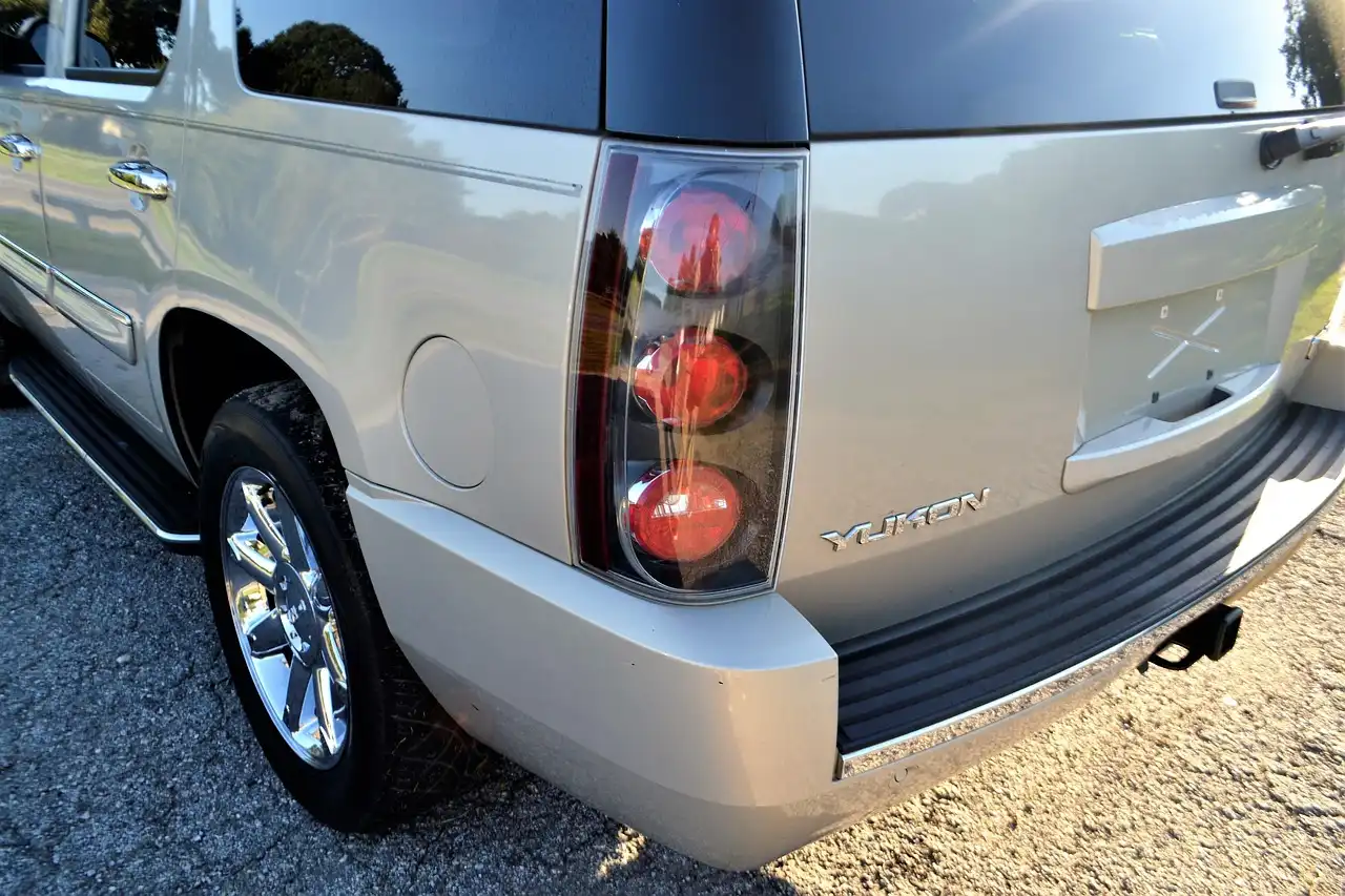 Tinted car window on a sedan in bright sunlight, showing privacy and heat reduction potential