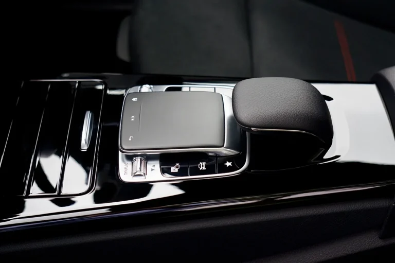 Three car console organizers displayed inside a sedan in natural light.