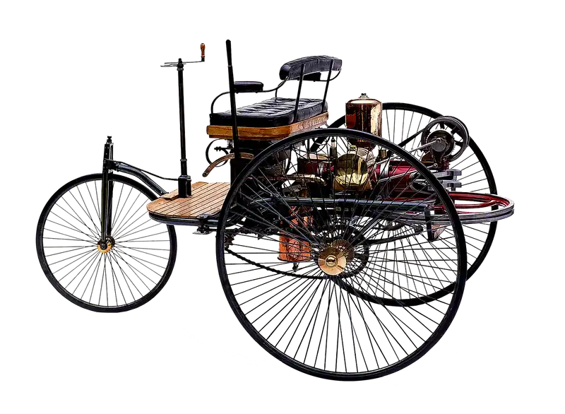 Three three-wheel cars parked on a sunny overlook, including sporty, touring, and compact models