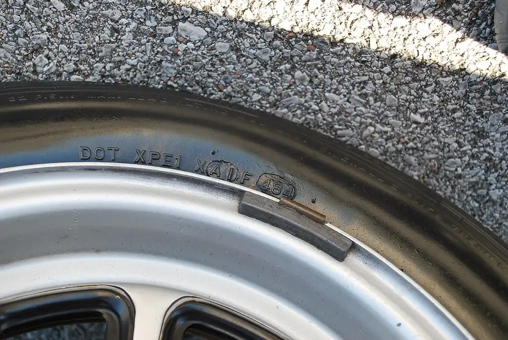 Close-up of BMW E30 suspension bushings showing wear and cracking
