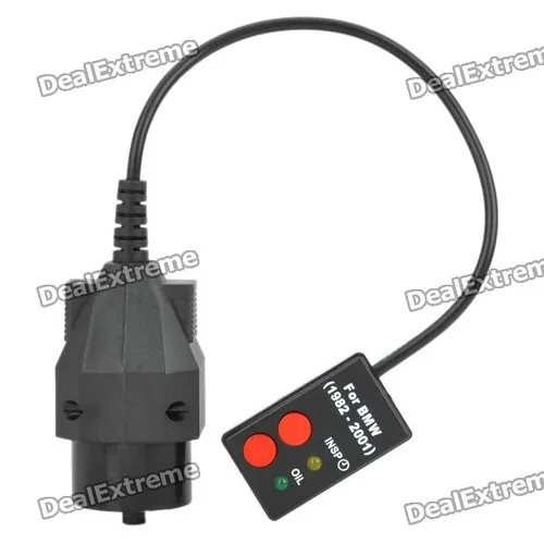 Close-up of a BMW OBD port with a diagnostic cable connected