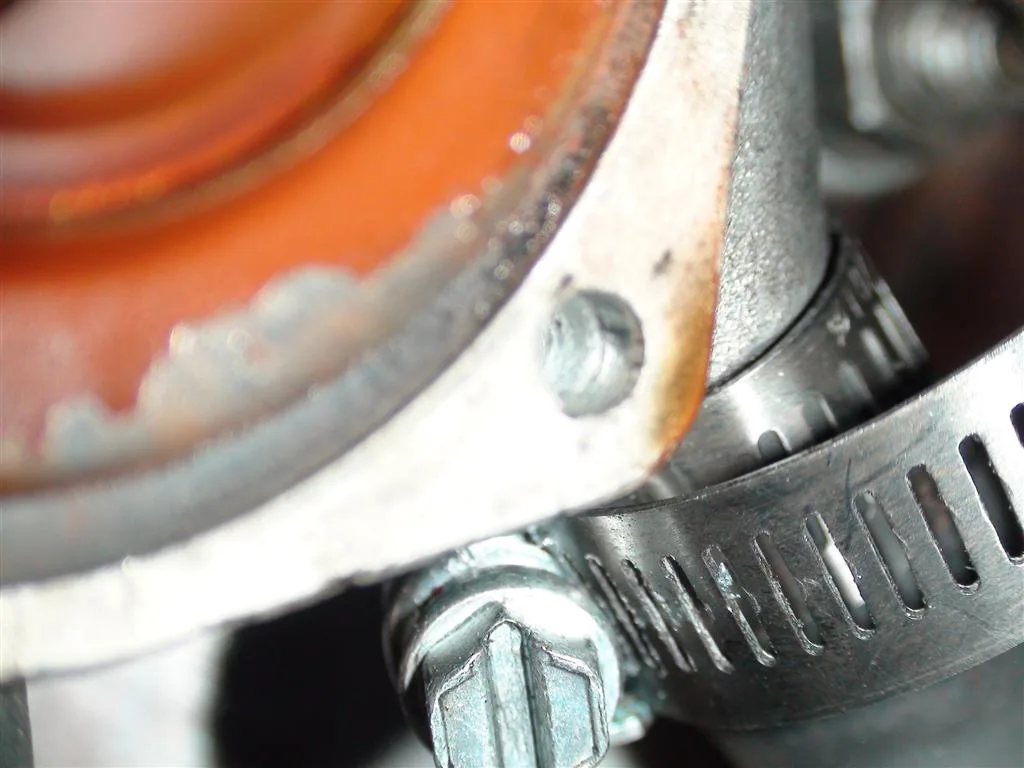 Home mechanic troubleshooting a BMW sedan in a garage with the front end disassembled