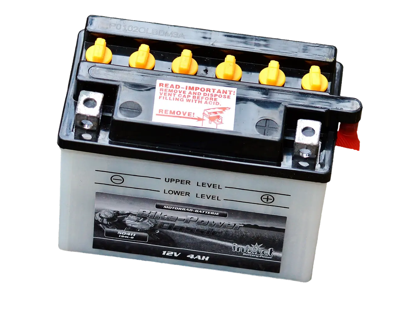 Car battery charger and maintainer beside a sedan in a garage with hood open