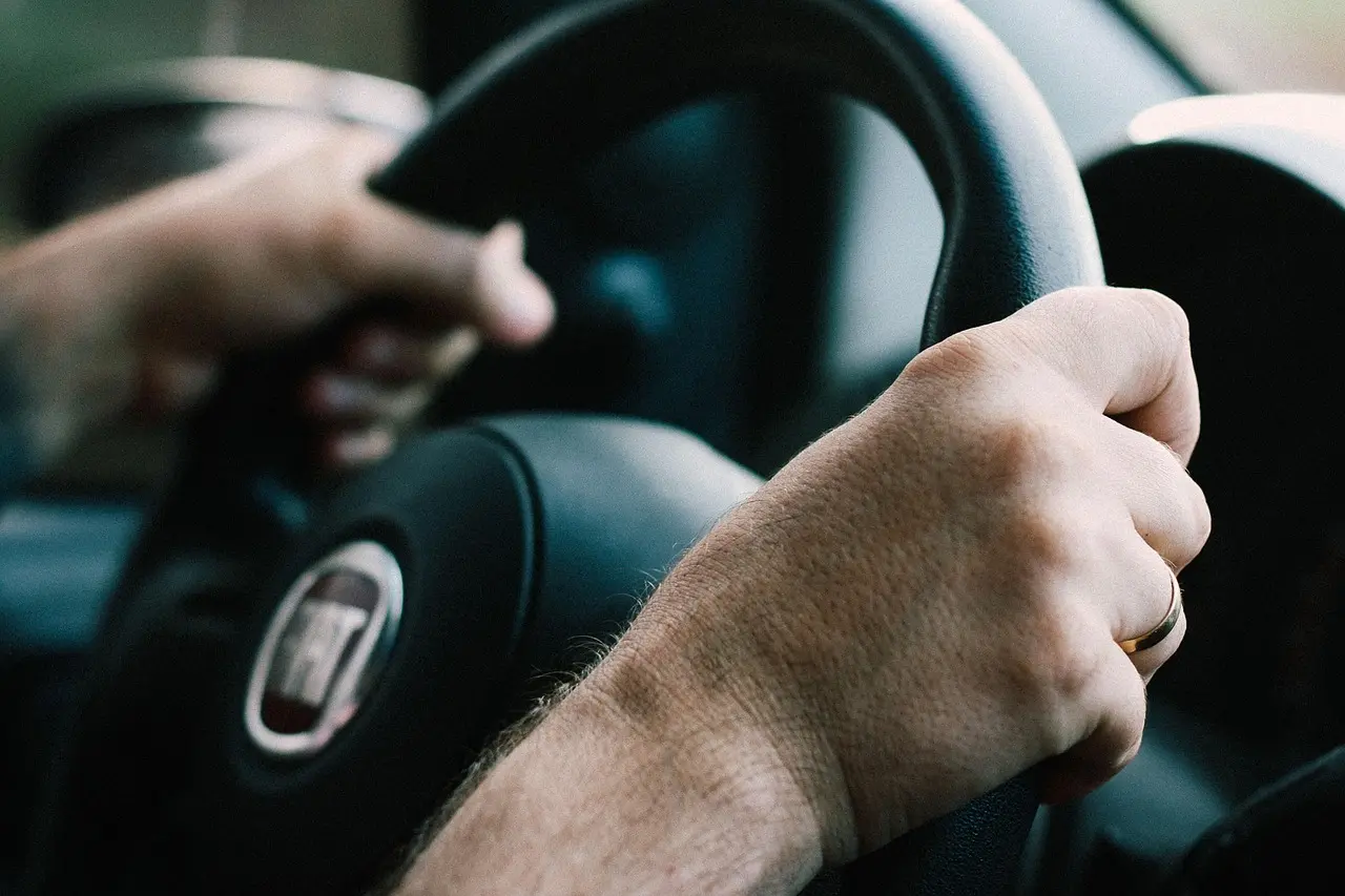What should I check besides the safety feature list when buying a car?