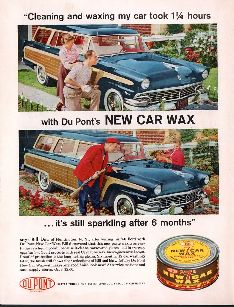 A hand applies wax to a car door panel with an applicator pad in natural daylight.