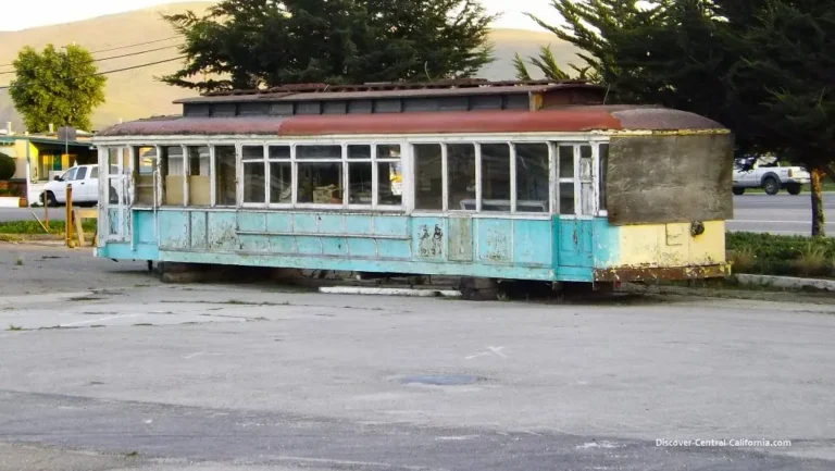 American roadside diner parking lot with drivers carrying burgers, fries, and milkshakes