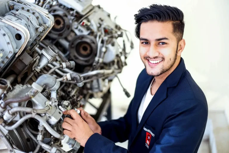 Automotive service advisor greeting a customer beside a car in a sunlit service bay