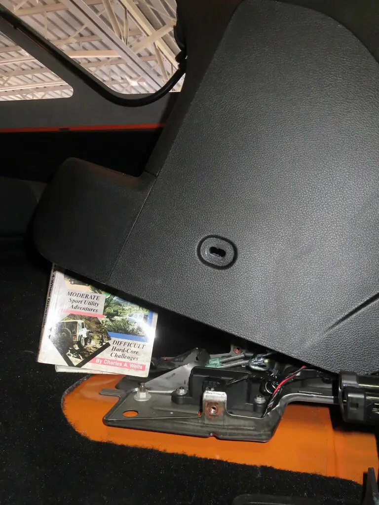Close-up of a dash cam beside a car security sensor inside a parked vehicle
