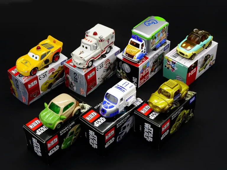 Hot Wheels cars arranged in wall and tabletop display cases in a bright hobby room