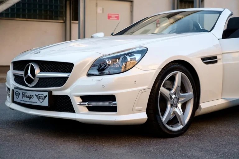 Car owner compares headlamp cleaner options beside a sedan with cloudy headlights.