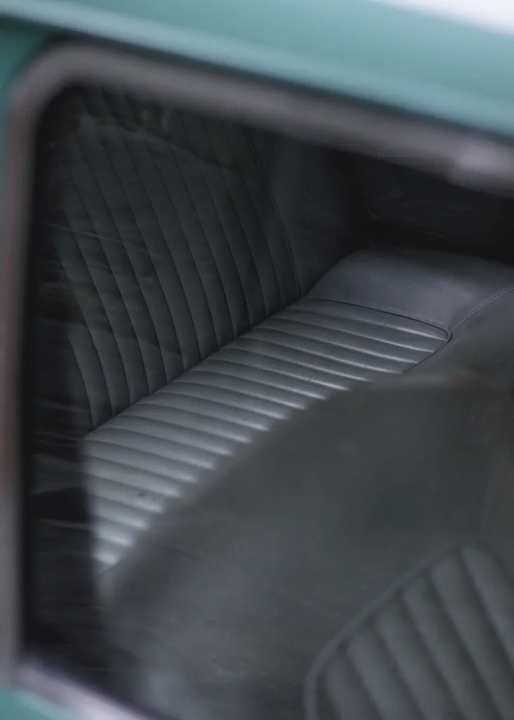 Honda Civic interior showing front seats with cloth and leather upholstery side by side