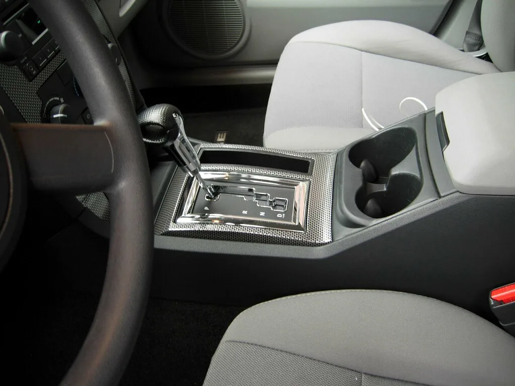 Close-up of a Honda Insight-style center console, touchscreen, and climate controls