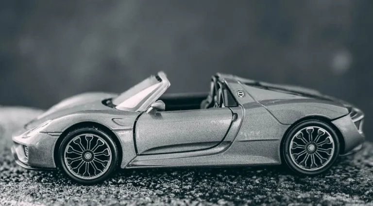 Hot Wheels Car Culture cars beside price tags and a receipt on a collector’s desk