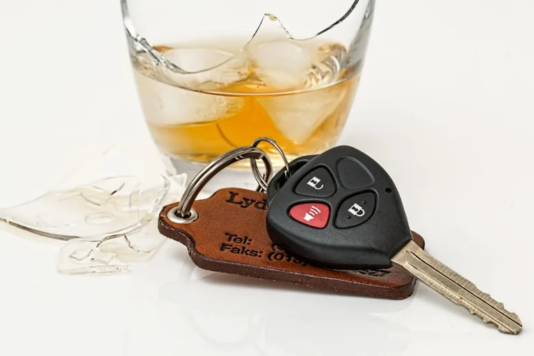 Worried car owner beside a sedan holding bills and keys in a driveway