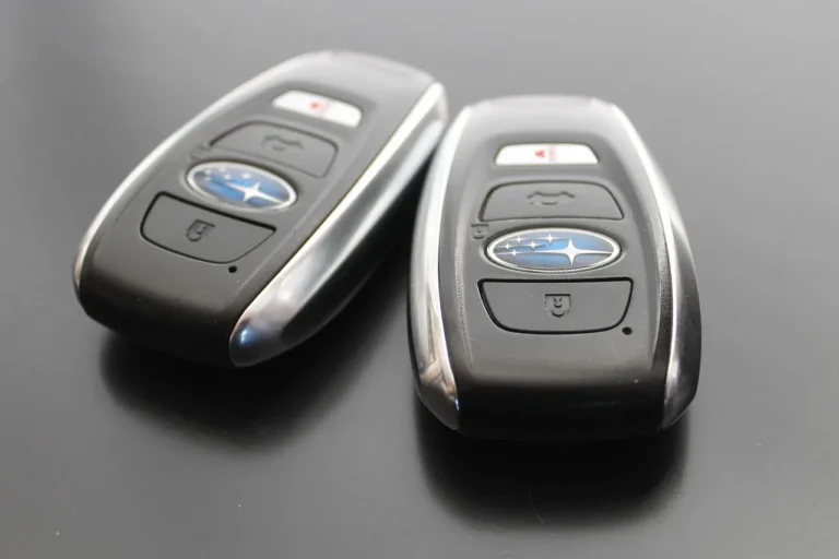 Driver holding a key fob beside a sedan, showing everyday keyless entry convenience
