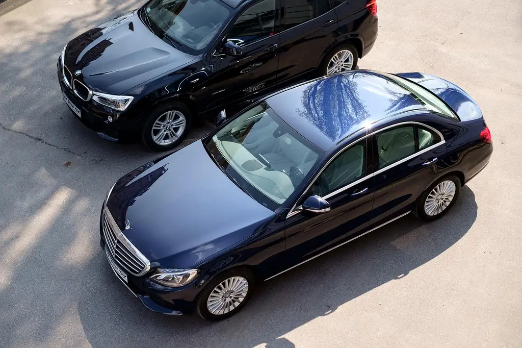 How do Tesla, BMW, Mercedes-Benz, and Toyota compare on automotive tech?