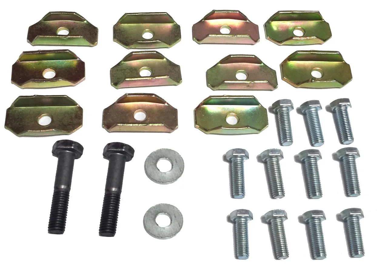 Automotive accessories laid out beside a sedan while a mechanic and owner compare their uses
