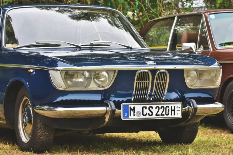 Silver BMW coupe parked outdoors in natural light, front three-quarter view with badge area visible