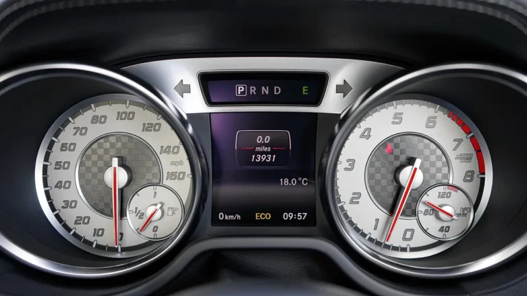 Modern electric sedan interior with a driver using a touchscreen and driver-assist display