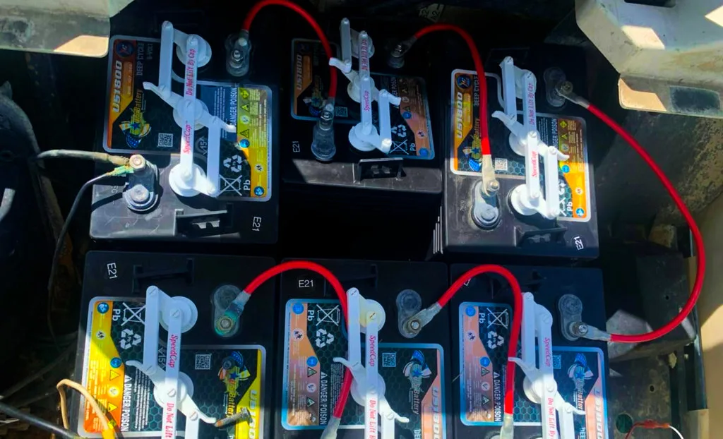 EV battery pack with cooling cables in a service bay