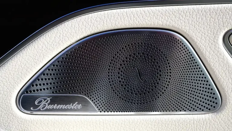 Mechanic measuring the speaker opening inside a 2004 Chevy Impala door panel