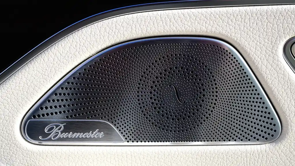 Mechanic measuring the speaker opening inside a 2004 Chevy Impala door panel