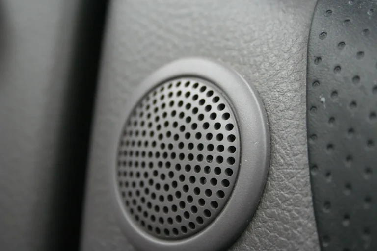 2001 Honda Accord sedan with open door and a mechanic measuring the speaker area